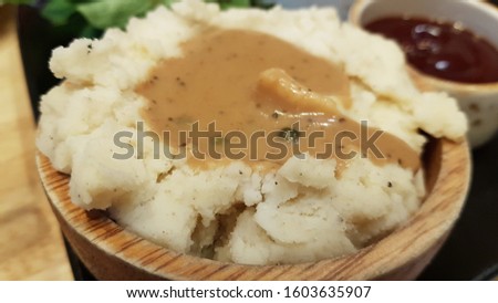 Mashed potatoes topped with brown sauce , blur picture