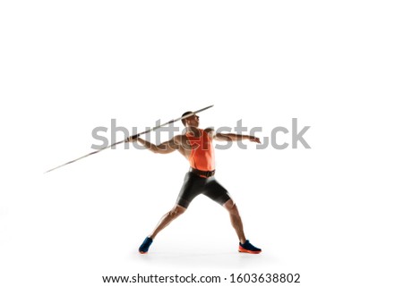 Male athlete practicing in throwing javelin isolated on white studio background. Professional sportsman training in motion, action. Concept of healthy lifestyle, movement, activity. Copyspace. Royalty-Free Stock Photo #1603638802