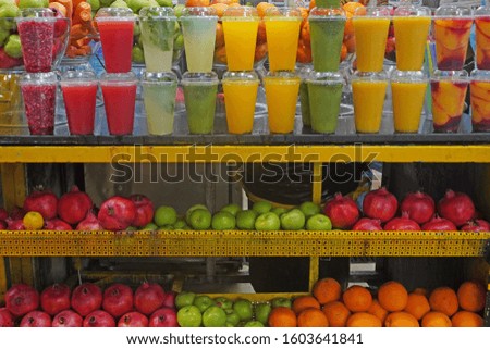 display of fruit smoothies and juicers in old city market Jerusalem                   