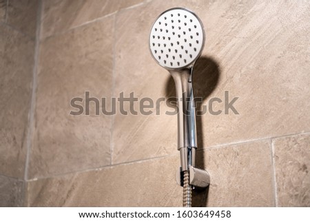 A close-up picture of shower head in the bathroom