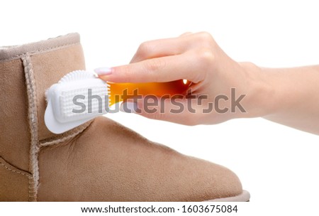 Shoe brush for cleaning suede leather shoes on white background isolation Royalty-Free Stock Photo #1603675084