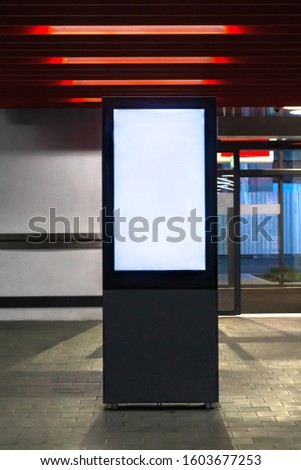 Blank mock up light box stands in front of the store entrance. Template vertical banner stand display indoor. Royalty-Free Stock Photo #1603677253
