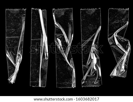 set of transparent adhesive tape or strips isolated on black background, crumpled plastic sticky snips, poster design overlays or elements.  Royalty-Free Stock Photo #1603682017
