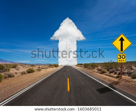 Cloud white arrow made of clods on the road