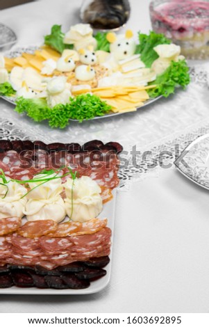Meat and cheese platter on the festive table