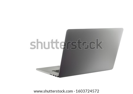 Open laptop notebook isolated on white background. Thin, modern looking. Copy space for text or image. Metallic silver color. Work from home or work from anywhere concept.