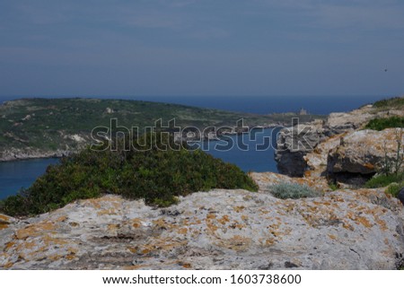 View from the island of San Nicola towards the island of Capraia and its abandoned lighthouse. Tremiti islands, Adriatic sea, Puglia, Italy