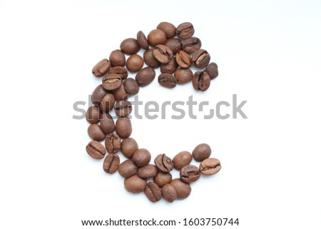 Letter "c" made from roasted coffee beans on the white background. Blend of 70% arabica and 30% robusta is used for this photo. Food Alphabet Theme.