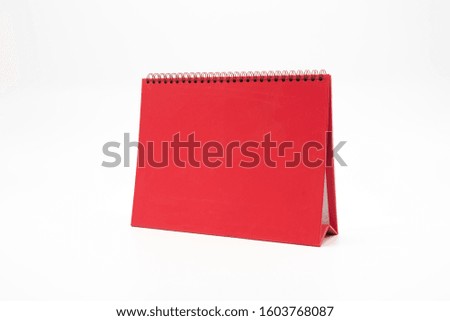 One red blank desk calendar isolated on white background