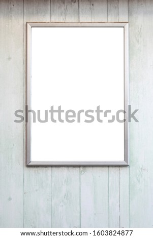 empty wooden frame on wooden wall ready for advertisements