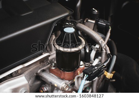 Close up of The old Exhaust gas recirculation in the engine compartment to reduce the carbon monoxide gas from the exhaust. automotive part concept. Royalty-Free Stock Photo #1603848127