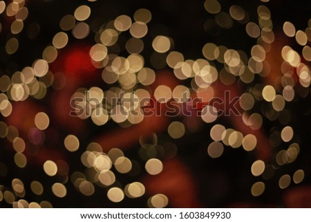 bokeh of lights on black background, red and glod bokeh.
