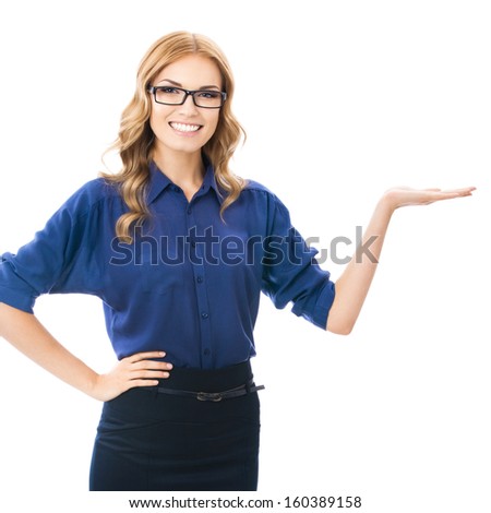 Happy smiling beautiful young business woman showing copyspace or something, isolated over white background