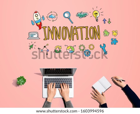 Innovation with people working together with laptop and notebook