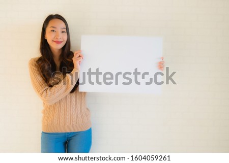 Portrait beautiful young asian women show blank white board card with copy space