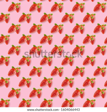 Seamless minimal summer fruits pattern of many whole strawberries on pink. Strawberries background.
