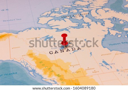 A Red Pin on Canada of the World Map Royalty-Free Stock Photo #1604089180