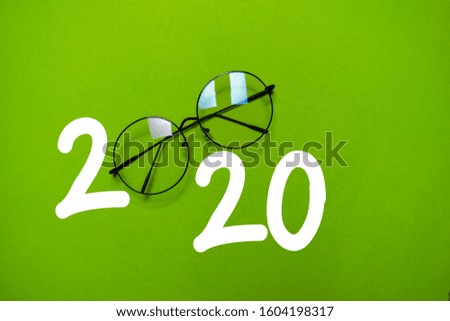 Happy New Year 2020 with Glasses isolated on the color table