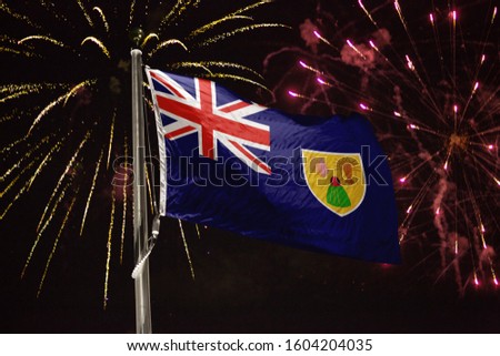 Turks and Caicos Islands flag blowing in the wind at night