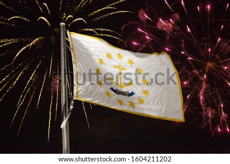 Rhode Island flag blowing in the wind at night