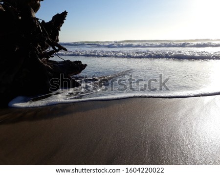 A beautiful picture of the waves crashing on the shores of Durbans beaches.This was taken at sunrise .