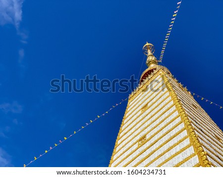View of Wat Phra That Nong Bua temple during afternoon with blue sky background, Ubon Ratchathani, Thailand