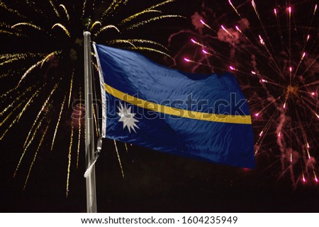 Nauru flag blowing in the wind at night