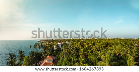 Kerala Amazing Travel and Tourism Image shot from Kannur Lighthouse, Beautiful Coconut Trees blue sky and sea, Nature beauty of God's own Country, india tourism image, aerial drone nature photography
