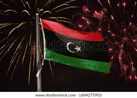 Libya flag blowing in the wind at night