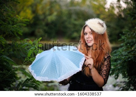 girl with a parasol. background. outdoors