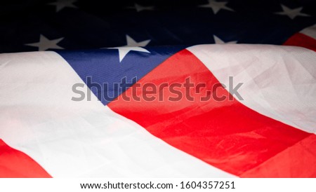 American flag Closeup. over the lying, wavy flag of the United States of America. Background.View from above. The concept of patriotism and freedom.4k.