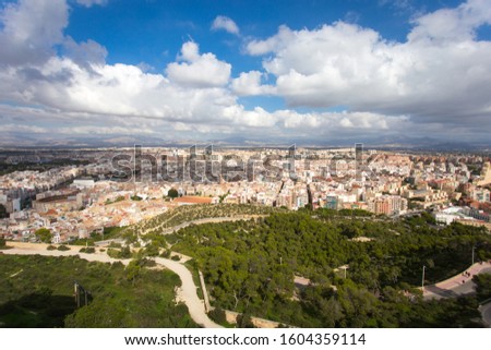 Photo of city next to sea taken on high building, panorama photo taken in sunny day and blue sky