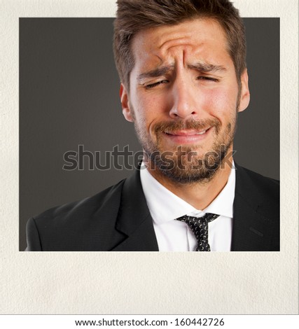 young man crying on photo frame