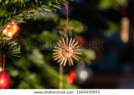 traditional straw star on christmas tree