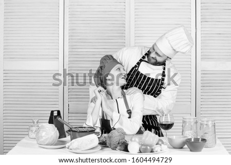 Ultimate cooking challenge. Couple compete in culinary arts. Reasons why couples cooking together. Cooking with your spouse can strengthen relationships. Woman and bearded man culinary partners.