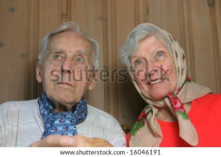 two elderly married people looking off into the distance