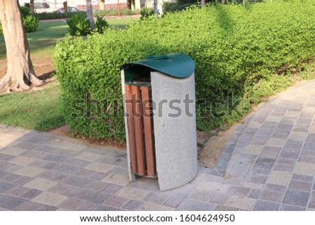 Waste Bin in the street, park, foot path with wood, steel and cement  