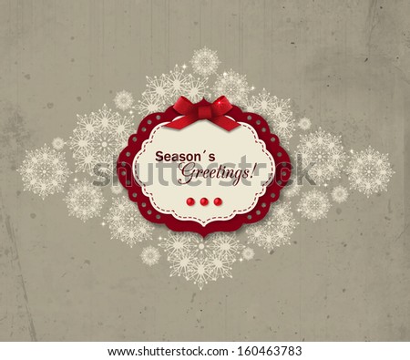 Christmas greeting  card. Season's Greetings. Vintage holiday background with ornate snowflakes  and scrapbook elements.