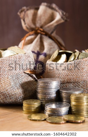 Financial concept. Coins on wooden background