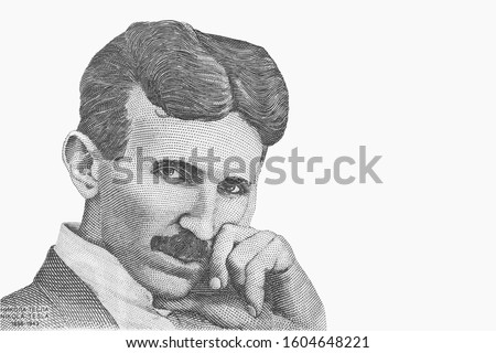 Portrait of Nikola Tesla. Genius scientist and inventor of electricity. Isolated from vintage paper banknote. Royalty-Free Stock Photo #1604648221