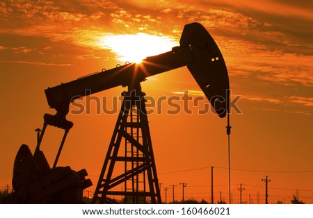 Oil Pump on orange sunset 