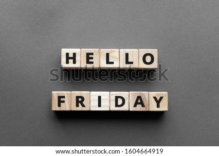 Hello friday - words from wooden blocks with letters, hello friday concept, top view gray background