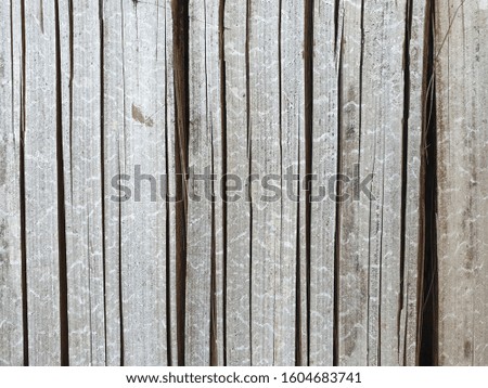 A wall of old gray and brown wooden boards