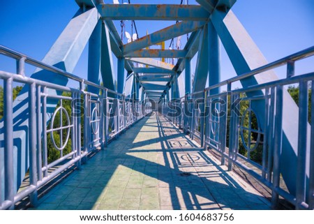 Blue suspension bridge and walkway
