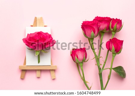 Canvas for painting with white eustoma flower on pink background , spring and creativity concept