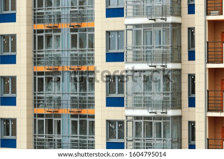 row of balconies on the facade of a modern residential building