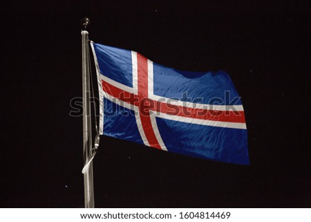 Iceland flag blowing in the wind at night