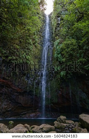 Beautiful waterfall at the end of a levada hike, trekking path, background picture