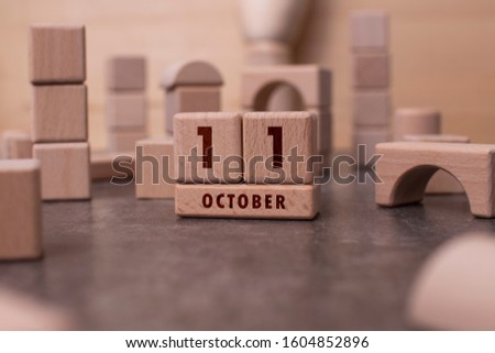 October 11 written with wooden blocks