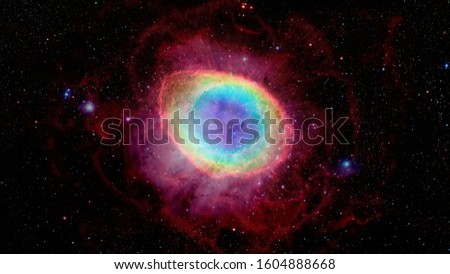 The Ring Nebula is a planetary nebula in the northern constellation of Lyra. Elements of this image furnished by NASA. Royalty-Free Stock Photo #1604888668